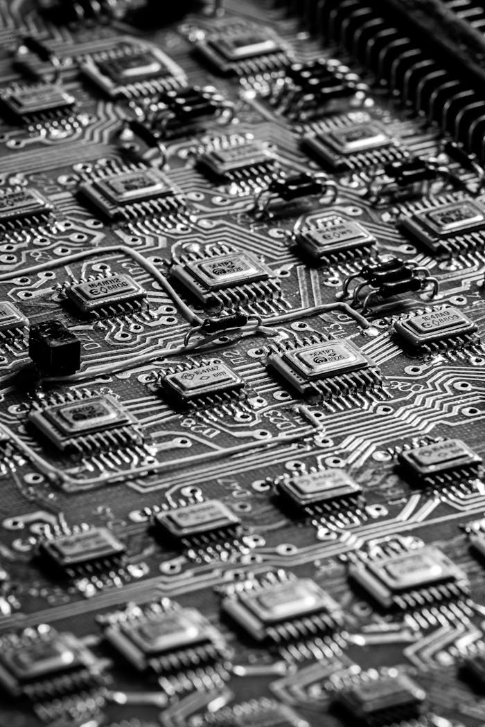mission-02 Close-up black and white image of a detailed circuit board, showcasing technological intricacies.